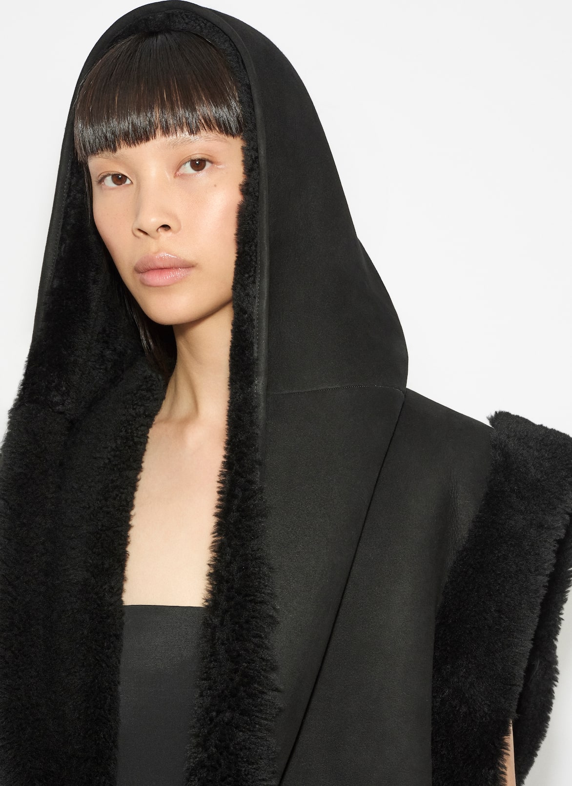 SHEARLING HOODED VEST ALAÏA BLACK SHEARLING HOODED VEST
